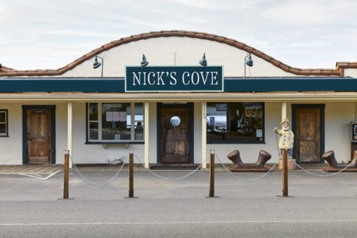 View of hand painted facade signage at Nick's Cove,